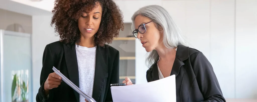 women viewing documents